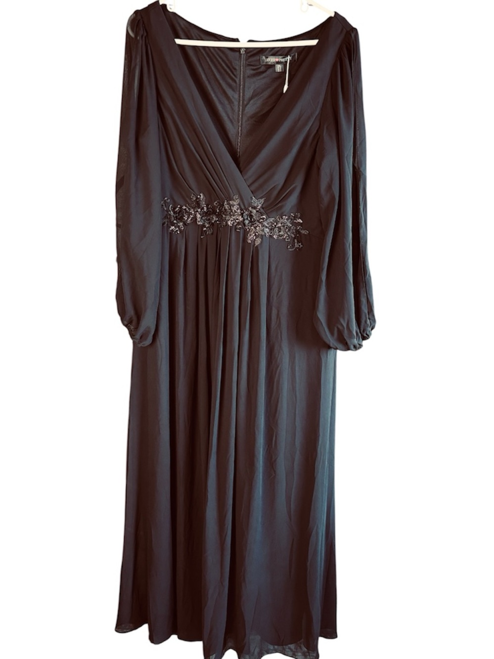 Women's beautiful black formal evening gown with beaded waist detail and chiffon